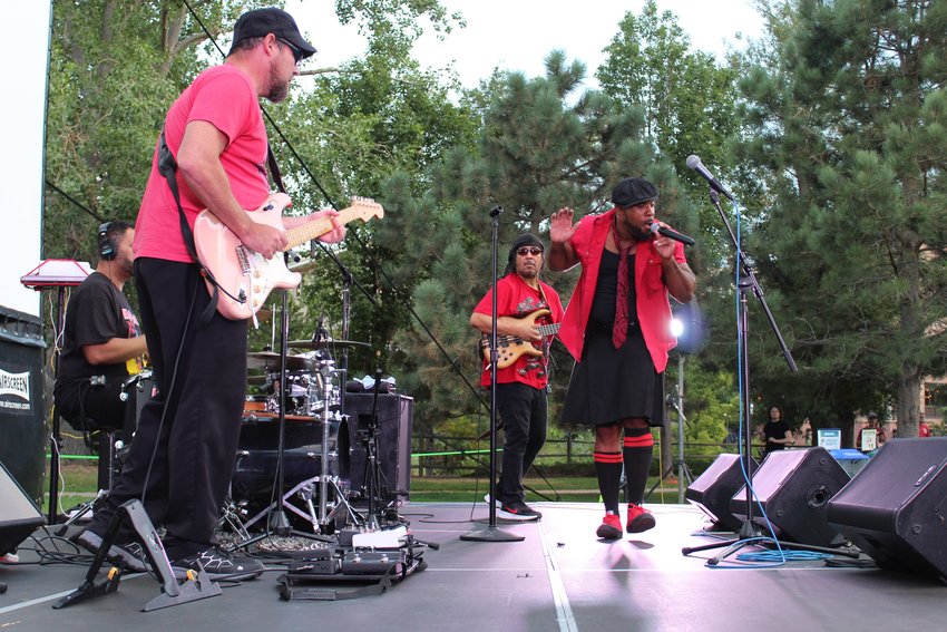 Little Moses Jones performs at the summertime Movies & Music in the Park event Aug. 12 at Parfet Park. The band performed a mix of 90s R&B, soul and funk songs before a screening of "The Princess Bride."